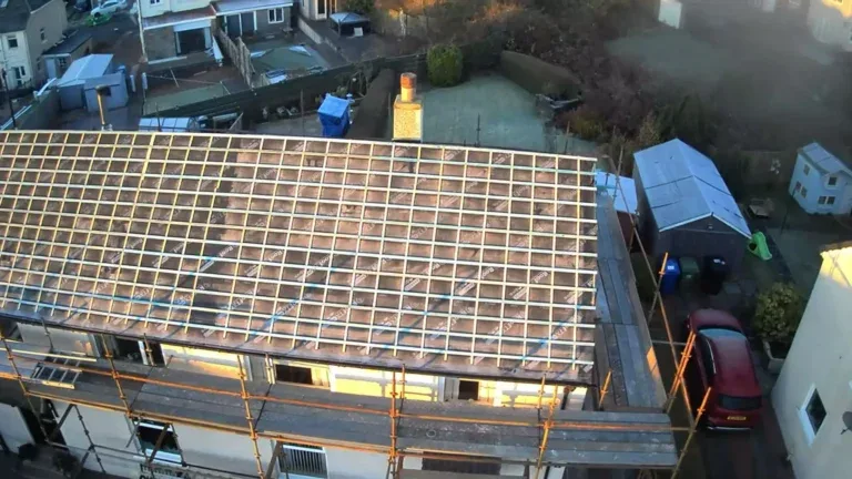 Aerial view of a roof with new battens fitted ready for tiling, with scaffold access